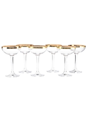 A Set of Six Crystal Coupe Glasses with Gilded Rims  