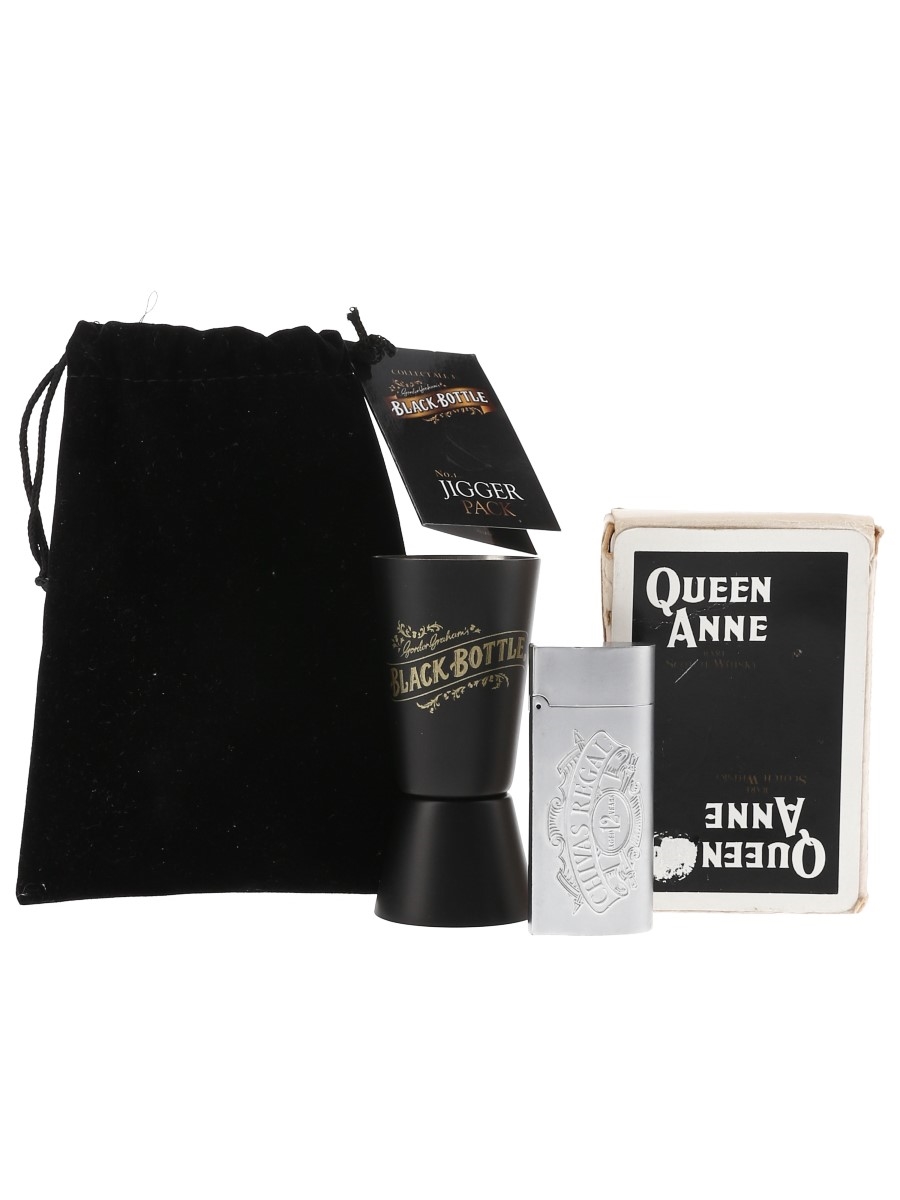 Assorted Whisky Memorabilia - Queen Anne, Black Bottle & Chivas Regal Including Paying Cards, Lighter Holder & Jigger 